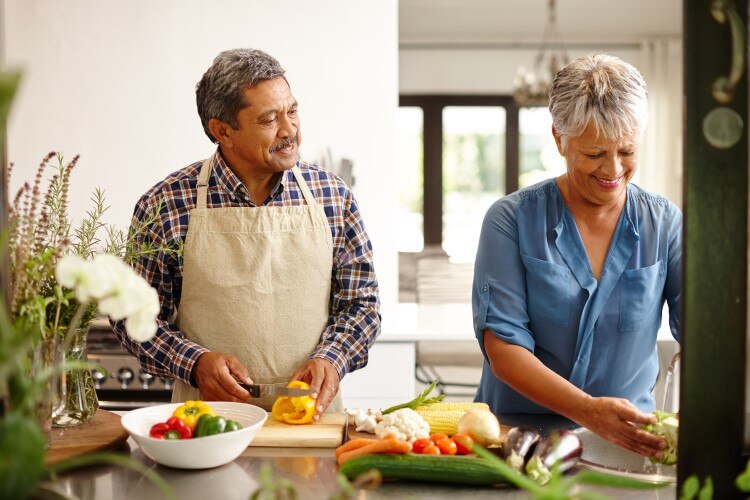 Couple preparing well balanced dinner with fibers and protein