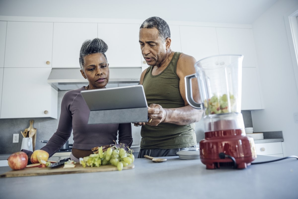 Man and Woman make protein shake