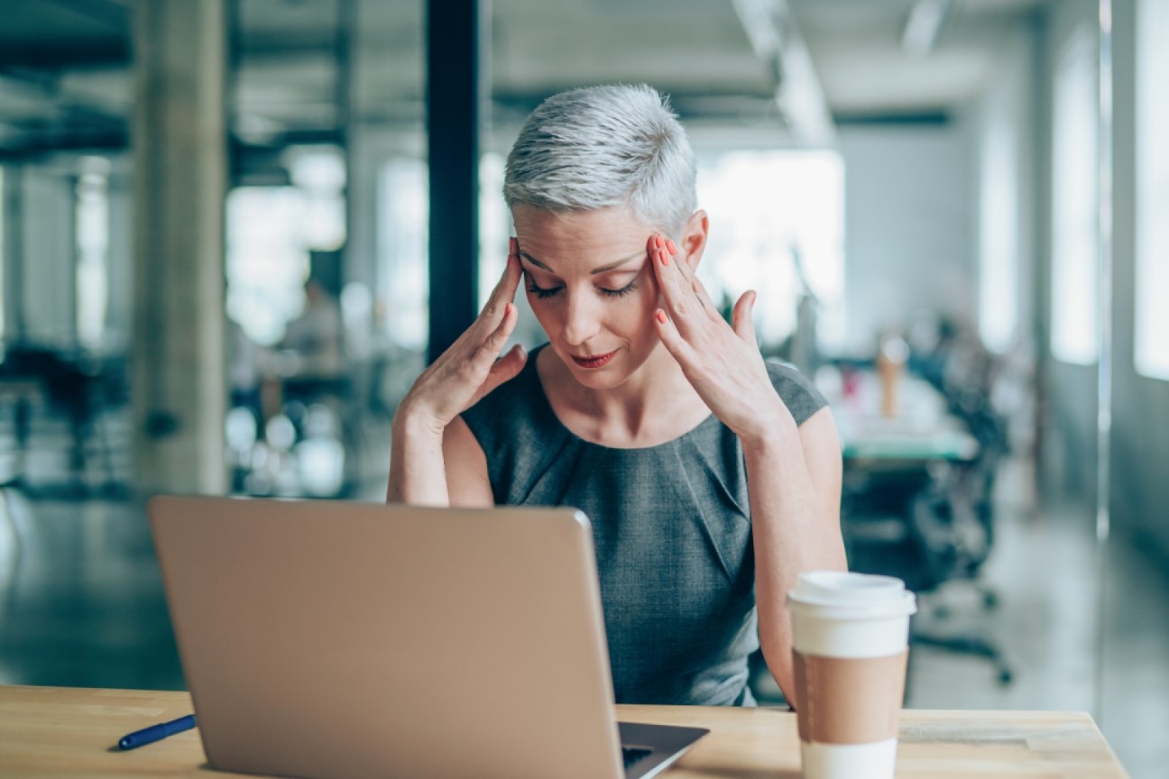 Woman is fatigued, often a sign of Vitamin B12 Deficiency 